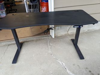 Black Wood-Looking 70" x 27" Electric Standing Desk Up to 48" Tall