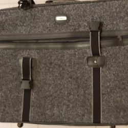 Vintage Gray suitcase with wheels.