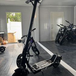 Electric scooter with shock absorption