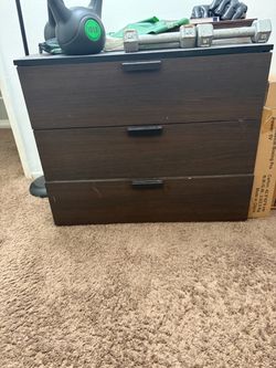 Sturdy dark wood dresser with three drawers