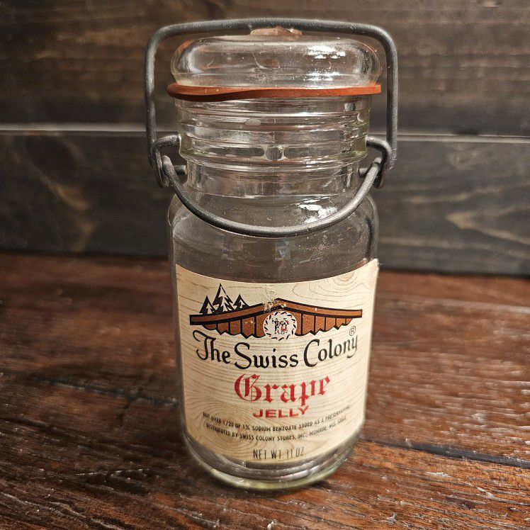 "Swiss colony" grape jelly antique glass jar.  empty