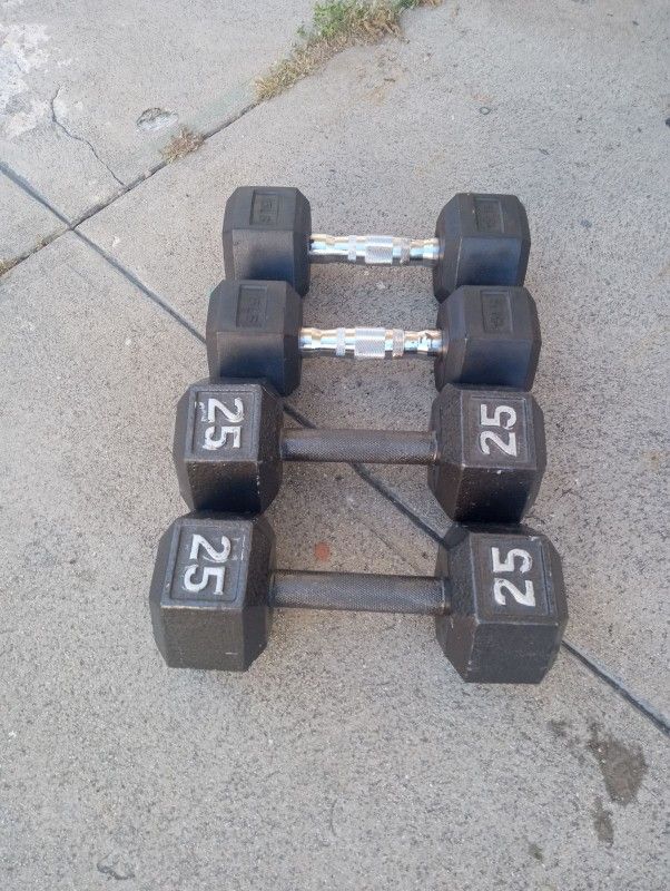 Two Sets Of Dumbbells 25 Lb 15 Lb