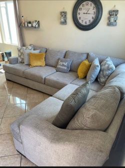Comfortable Beige sectional couch from Jerome’s
