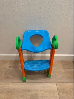 Toddler over the toilet potty seat with steps