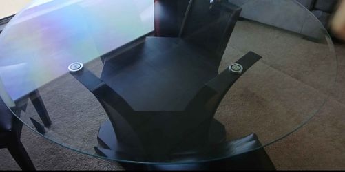 Newer round glass table with 3 chairs