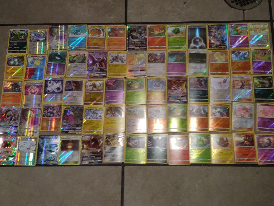 Must sell now!!! Over 500 mint condition pokemon cards with 72 holograms. 1 trainer tin. 1 trainer box and 15 online bonus cards