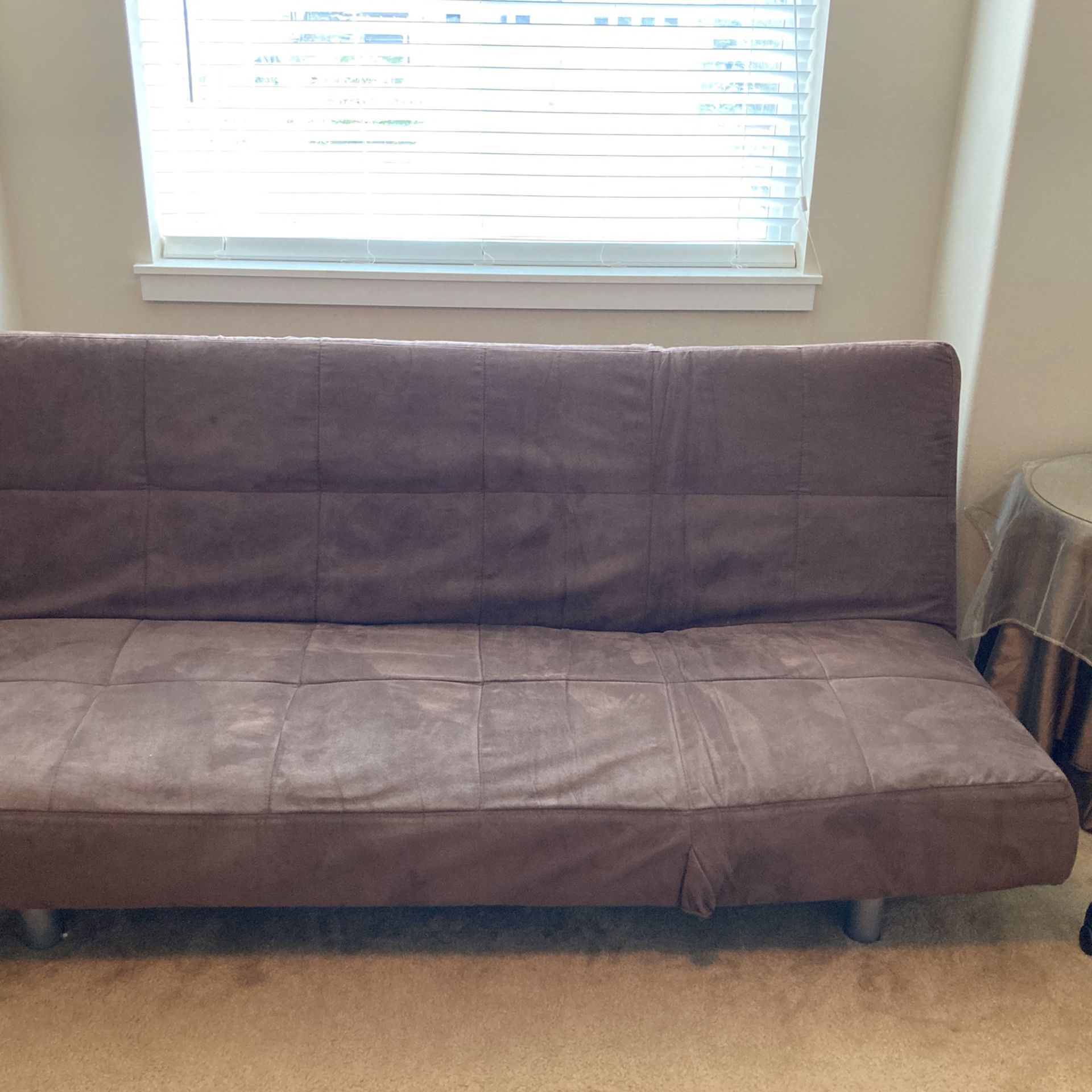 Futon sofa that makes into a bed