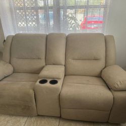 Tan loveseat and recliner