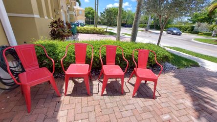 Set of 4 red metal chairs