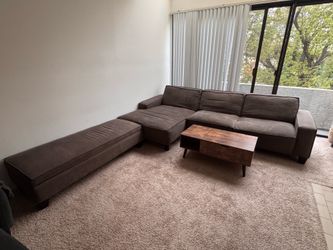 Gray couch with rectangular ottomon ( has storage space)