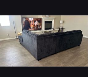 L shaped dark grey sofa couch
