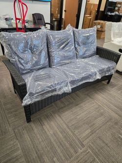 patio sofa with cushions, a little damage on the back corner. brand new.