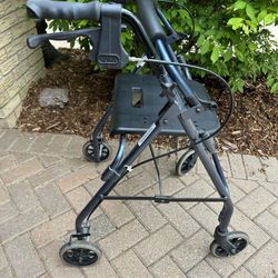 Walker, Lightweight, Folds Up, Like New With seat. 