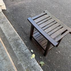A Wood Bench With A Shelf Underneath