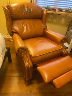Leather recliner chair with nail heads. Pushback to recline . Very comfortable . See all photos.