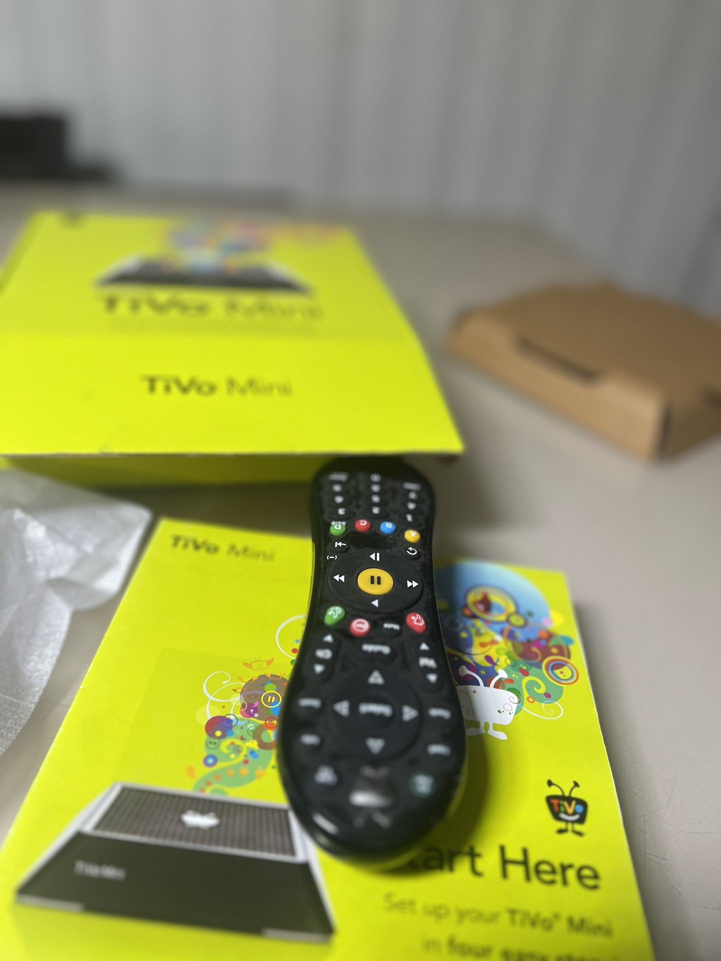 TiVo TCDA93000 Mini Receiver With Voice Remote Loaded With Extras. Used in good condition with minor cosmetic blemishes these blemishes are limited to