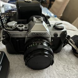 Canon AE-1 Camera And Accessories 