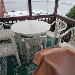 Outdoor Patio Table And Chairs With A New Umbrella And Cover  , Italian Design Bedroom Furniture Set That Is Black And Brown Swirl Design And Is Very 