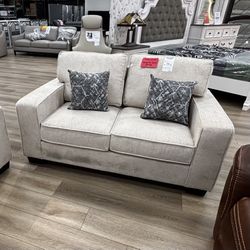 Beige Fabric Loveseat With Pillows 