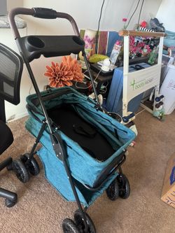 Like New Turquoise Dog Stroller With Double Spin Wheels And Cover 