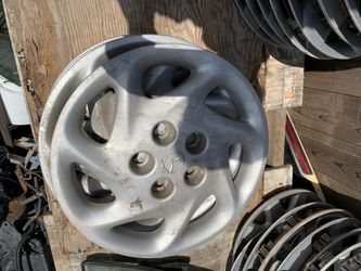 4 hub cap Oem Mazda 626 15”