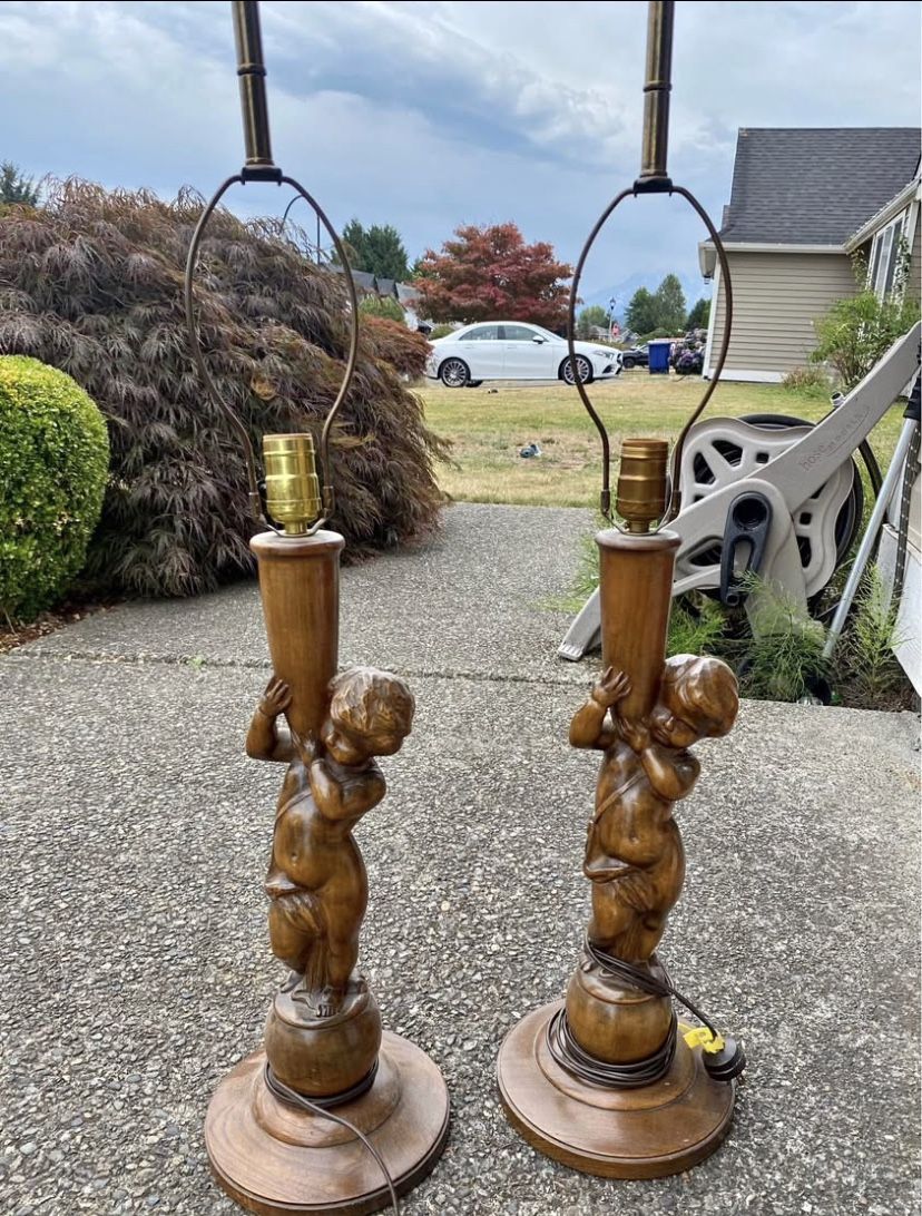 Pair of antique oak cherub table lamps in good condition