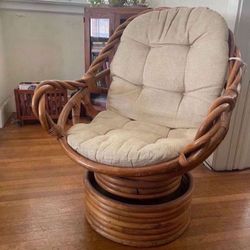 Rattan swivel chair with braided arms