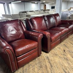 Delivery Available burgundy, leather sofa/couch, and chair recliner