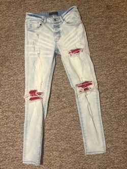 Light Wash Distressed Jeans with Red Patches