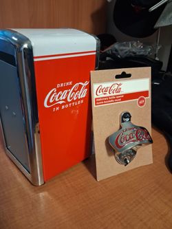 Beautiful Americana, Coca-Cola Bottle opener & Napkin holder/dispenser. New . Located in uptown 1224 w Wilson Ave 60640. Cash only pick now available