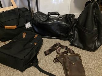 Full men’s travel duffle bags, over the shoulder bag, satchel, backpack and garment bag. Black and brown real leather and canvas fabric