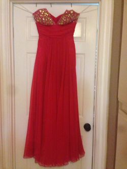 Beautiful dress coral size asking 50 used only one time negotiable