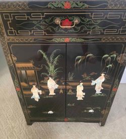 Black Lacquer cabinet with Pearl Inlays. 36" High 24" Wide