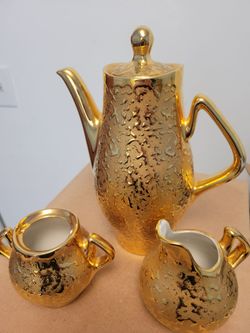 Coffee pot with creamer and sugar bowl