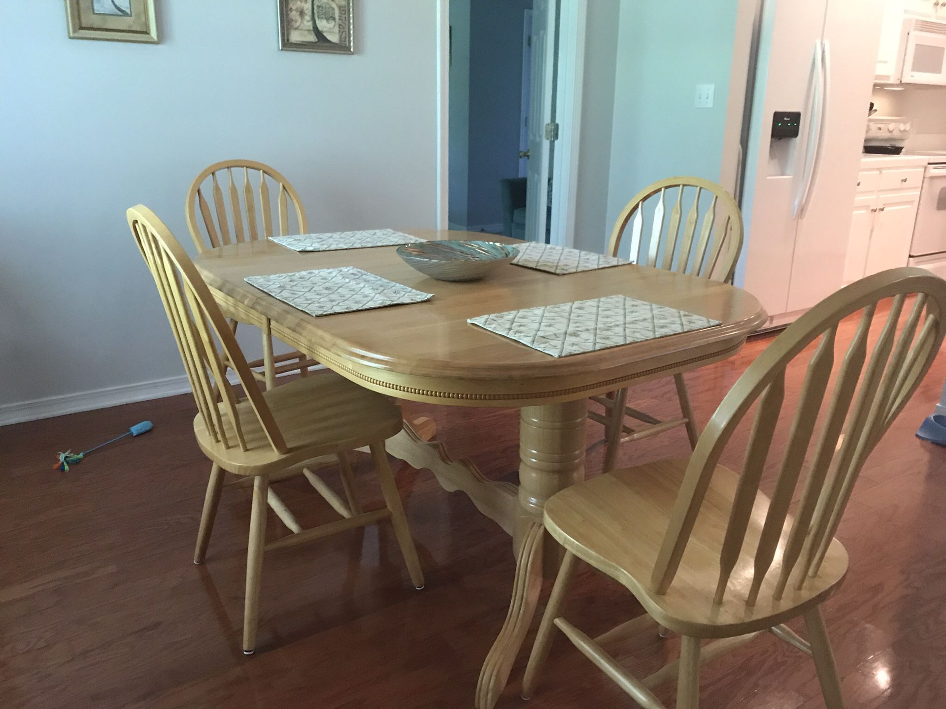 Dinning room table with leaves and 4 chairs and more...