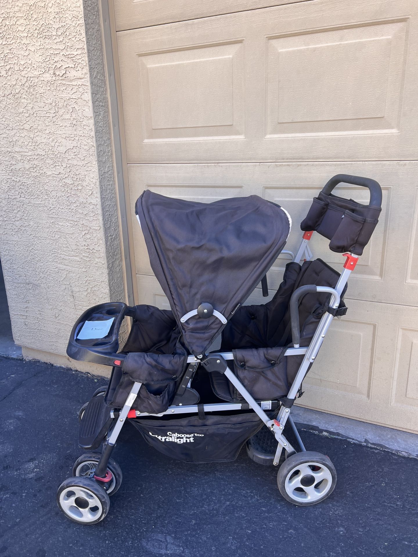The image shows the Joovy Caboose Too Ultralight stroller.