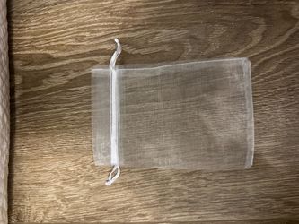 White organza party favor bags