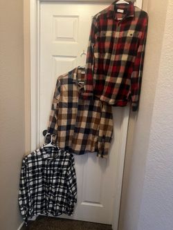 Young men’s size medium plaid button up/3 shirts