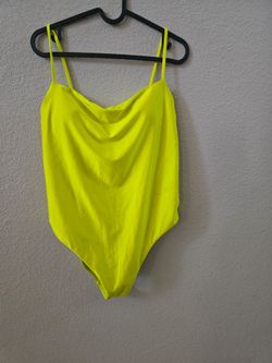 Vibrant lime green cowl neck swimsuit with thin straps. Smooth fabric and fitted silhouette. Bold color for standout outfits. Size large.