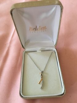 Nice gold & silver next necklace with small diamonds in it