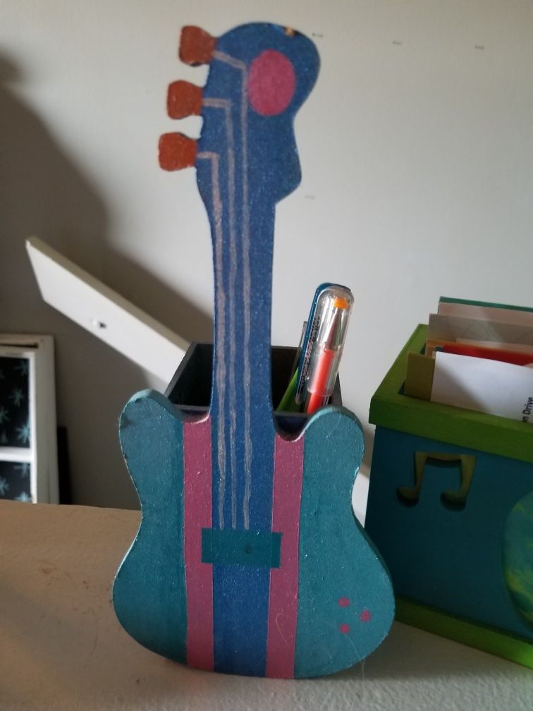 Guitar pencil and letter holder