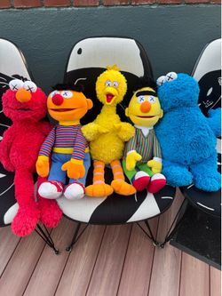 Kaws X Sesame Street plushie dolls 1 Takashi Murakami flower