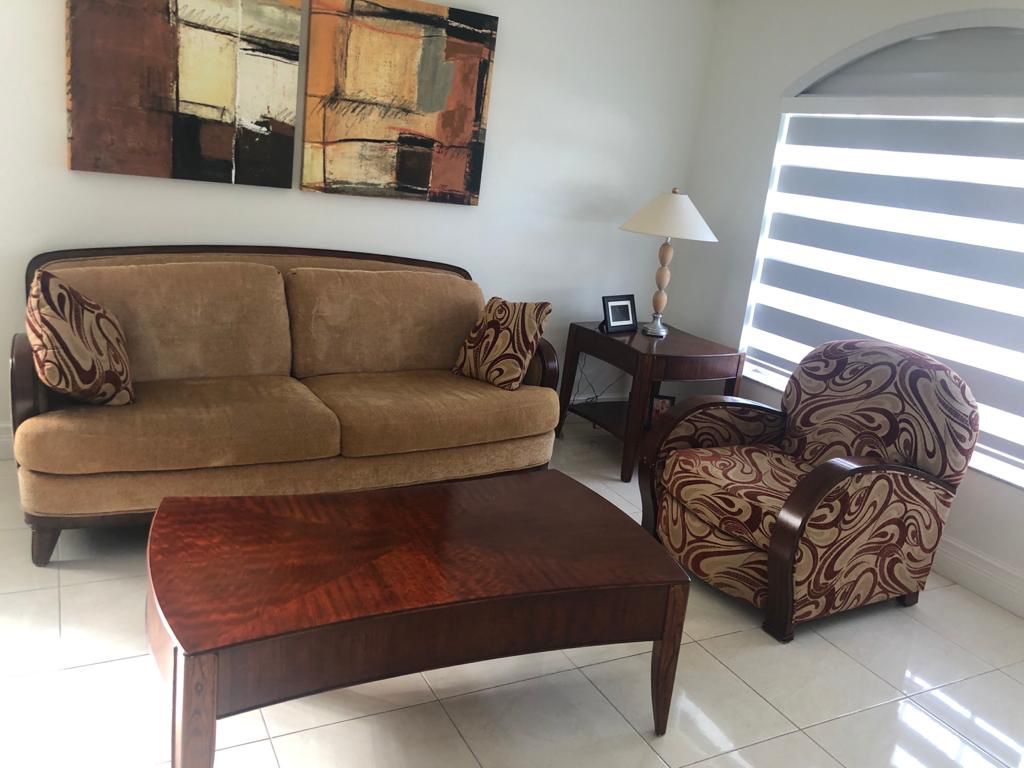 Sofa with occasional chair, tea table, corner table
