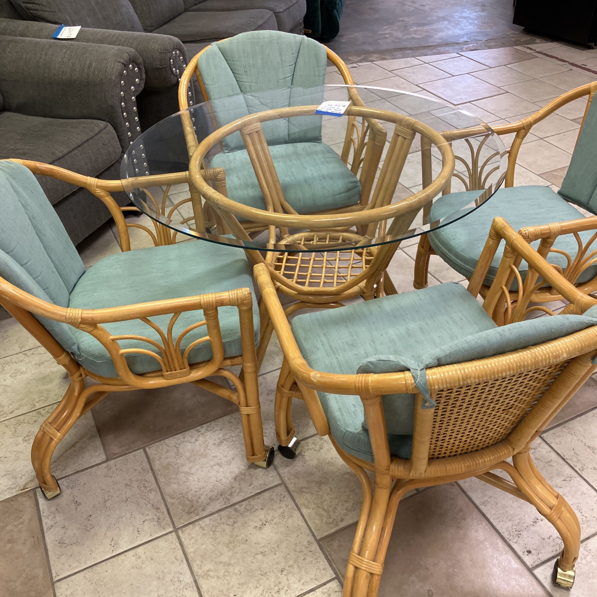 Wicker Table With 4 Rolling Chairs 