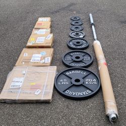 NEW IN BOX Olympic Plates-255lbs & 7ft Barbell 