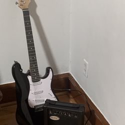 Two Electric Guitars With One Amp, One Case And Strings