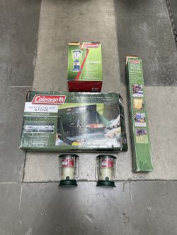 Coleman Stove With Stand. Propane Lantern. Two Battery Lanterns. Two Citronella Candles. 