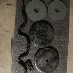 Old school 25 LB Plates and Bar and 10 LB Plates