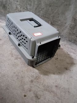 pet travel carrier crate with a black top handle and side ventilation slats. 19"LX13"WX11"H