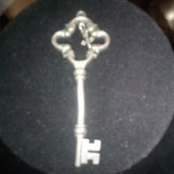 A Key Lock With Cross Jewelry 